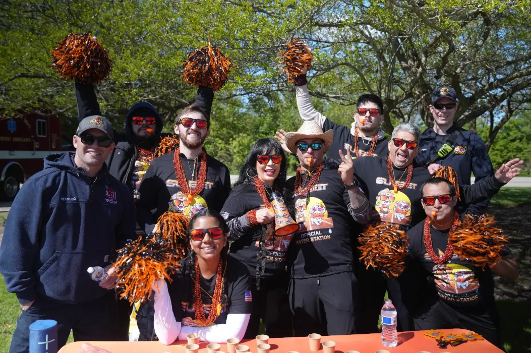 Our Team at our Water Station for runners | Sunset Tire and Auto Repair
